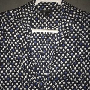 Long sleeve tee. Black and white with blue flower.